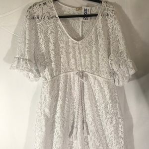 White swimsuit cover-up.